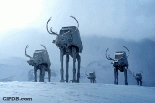 A Group Of At At Walkers With Antlers On Their Heads GIF