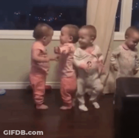 A Group Of Babies Are Dancing Together In A Room GIF