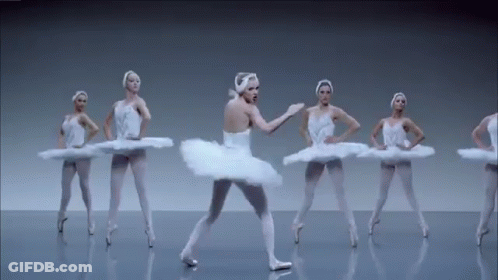 A Group Of Ballerinas Are Dancing In A Row On A Gray Background . GIF