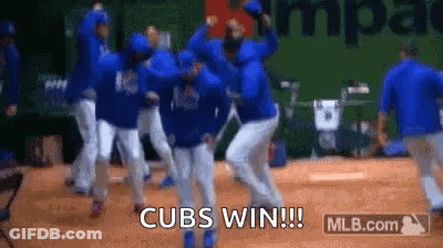 A Group Of Baseball Players Are Dancing On A Baseball Field . GIF