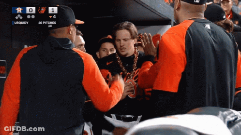 A Group Of Baseball Players Are Gathered In A Dugout With A Scoreboard That Says Uquidy GIF
