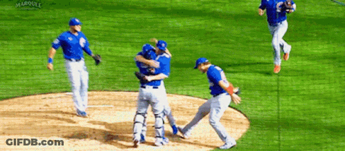 A Group Of Baseball Players Are Hugging Each Other On A Field That Says Marquee On The Bottom GIF