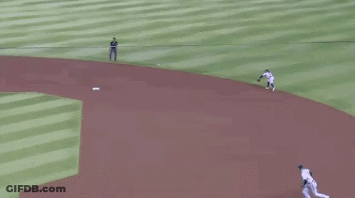 A Group Of Baseball Players Are Playing A Game Of Baseball On A Baseball Field . GIF