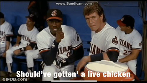 A Group Of Baseball Players Are Sitting In A Dugout With The Words Should Ve Gotten A Live Chicken GIF