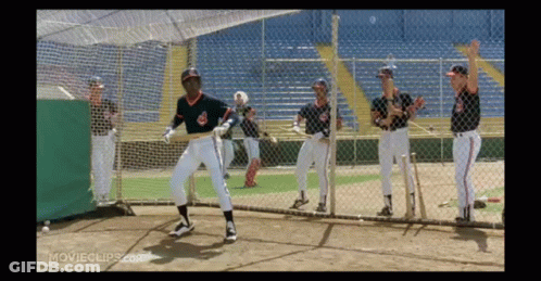 A Group Of Baseball Players Are Standing Behind A Fence With Movieclips.com Written On The Bottom Of The Screen GIF