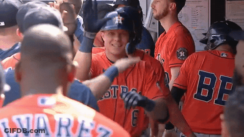 A Group Of Baseball Players Are Standing In A Dugout And One Of Them Is Wearing A Jersey That Says Be On It GIF