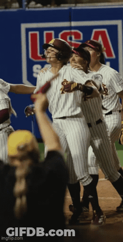 A Group Of Baseball Players Are Standing In Front Of A Wall That Says Usa GIF