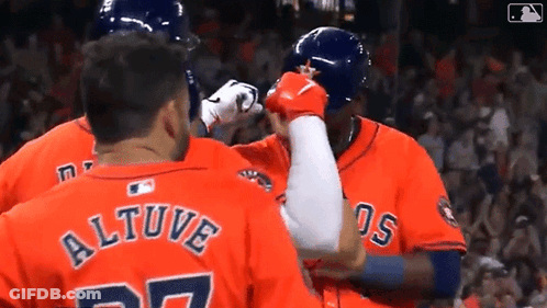 A Group Of Baseball Players Are Standing Next To Each Other And One Of Them Has The Name Altuve On His Back . GIF