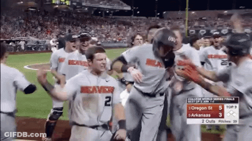 A Group Of Baseball Players Are Standing On A Field And One Of Them Has The Number 2 On His Shirt GIF