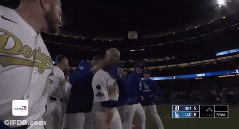 A Group Of Baseball Players Are Standing On A Field With A Scoreboard That Says Det 5 Lad 8 GIF