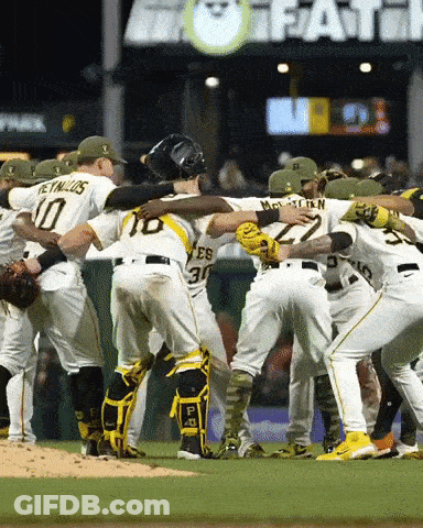 A Group Of Baseball Players Huddle Together With One Wearing The Number 30 GIF