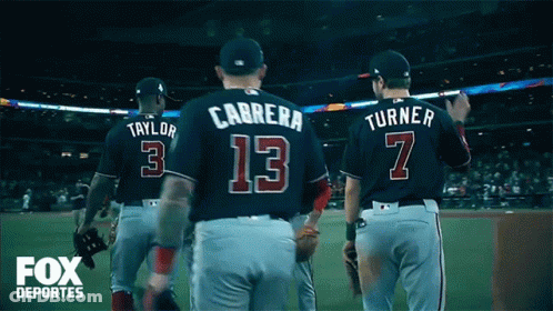 A Group Of Baseball Players Including Carrera Number 13 And Turner Number 7 Walk Off The Field GIF