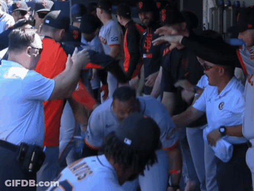 A Group Of Baseball Players Including One With The Number 13 On His Jersey GIF