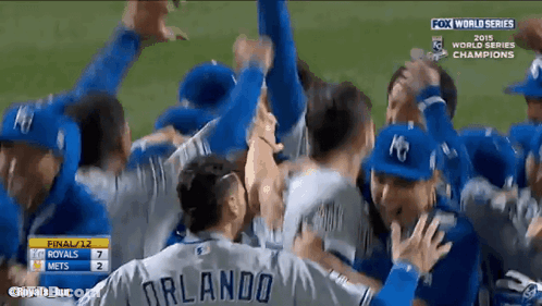 A Group Of Baseball Players Including Orlando Are Celebrating On The Field GIF