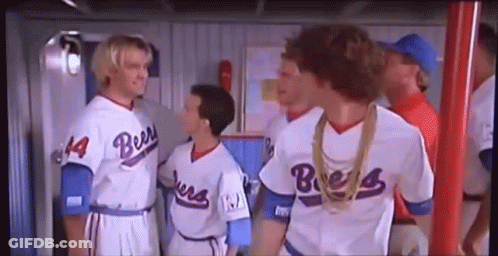 A Group Of Baseball Players Standing Next To Each Other In A Locker Room . GIF