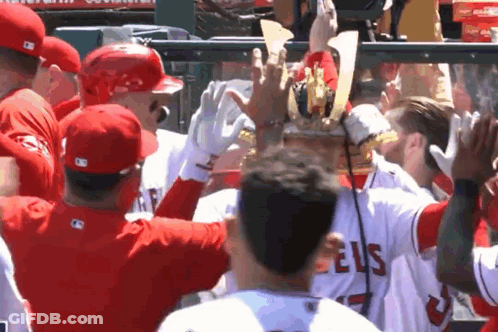 A Group Of Baseball Players Wearing Angels Jerseys GIF