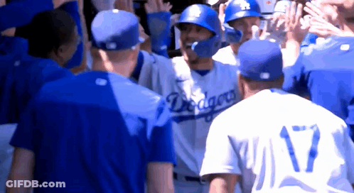 A Group Of Baseball Players Wearing Blue Jerseys With The Word Dragons On Them GIF