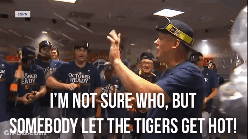 A Group Of Baseball Players Wearing October Ready Shirts Are Gathered In A Room GIF