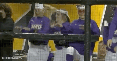 A Group Of Baseball Players Wearing Purple Shirts With Imu On Them GIF