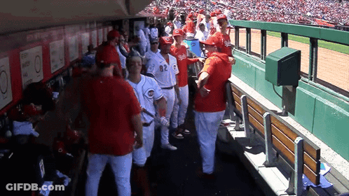 A Group Of Baseball Players Wearing Red Uniforms With The Number 82 On The Back GIF