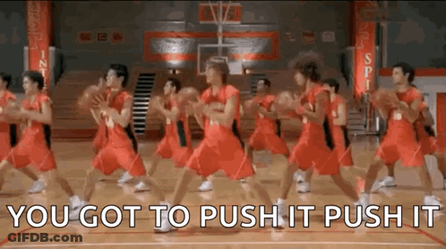 A Group Of Basketball Players Are Dancing On A Court While Holding Basketballs . GIF