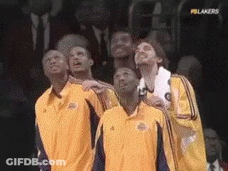 A Group Of Basketball Players Are Looking Up At The Sky GIF