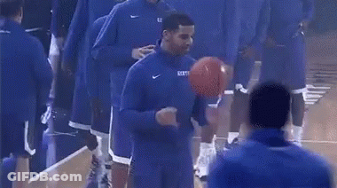 A Group Of Basketball Players Are On A Court And One Of Them Is Wearing A Kentucky Jersey GIF