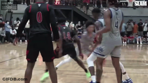 A Group Of Basketball Players Are Playing A Game And One Player Has The Number 4 On His Jersey GIF