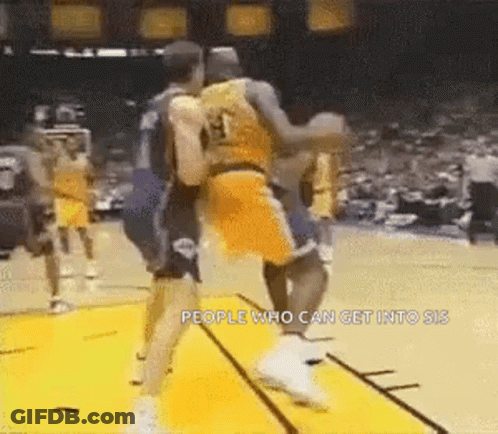 A Group Of Basketball Players Are Playing A Game Of Basketball And One Of Them Is Wearing A Number 13 Jersey . GIF