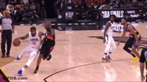 A Group Of Basketball Players Are Playing A Game Of Basketball . GIF