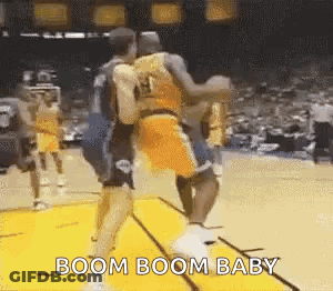 A Group Of Basketball Players Are Playing A Game Of Basketball . GIF
