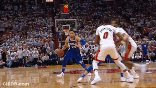 A Group Of Basketball Players Are Playing A Game Of Basketball . GIF