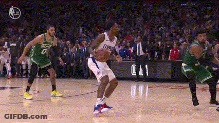 A Group Of Basketball Players Are Playing A Game On A Court And One Of Them Has The Number 8 On His Jersey GIF