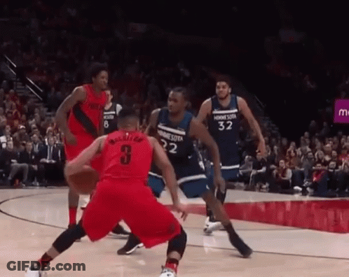 A Group Of Basketball Players Are Playing A Game On A Court . One Of The Players Has The Number 3 On His Jersey . GIF
