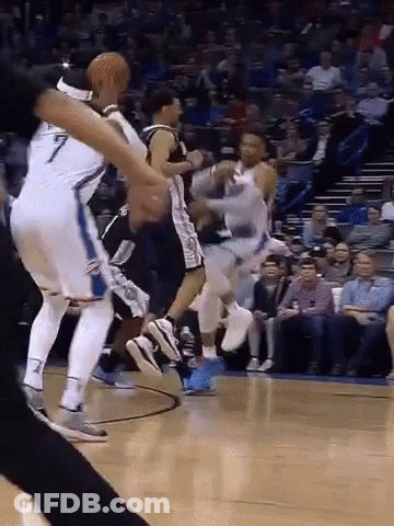A Group Of Basketball Players Are Playing A Game On A Court . GIF