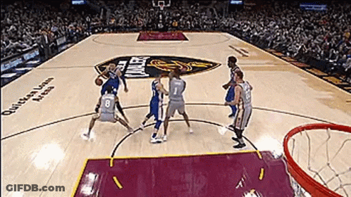 A Group Of Basketball Players Are Playing A Game On A Court That Says Queens Lawn Arena GIF