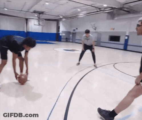 A Group Of Basketball Players Are Playing A Game On A Court With A Logo On The Wall That Says ' A ' GIF
