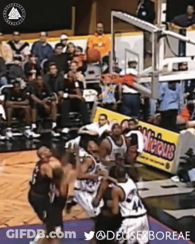 A Group Of Basketball Players Are Playing A Game On A Court With A Sign That Says Vicious GIF