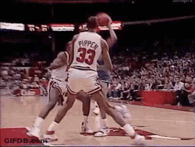 A Group Of Basketball Players Are Playing Basketball On A Court . One Of The Players Is Wearing A Number 33 Jersey . GIF