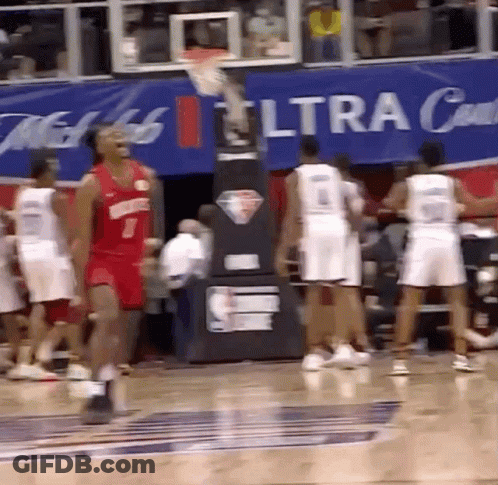 A Group Of Basketball Players Are Playing In Front Of A Banner That Says Ultra GIF