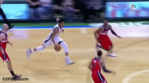A Group Of Basketball Players Are Playing On A Court . GIF