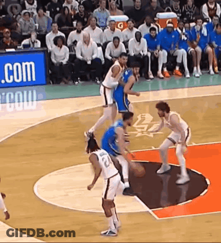A Group Of Basketball Players Are Playing On A Court With A Gatorade Sign Behind Them GIF