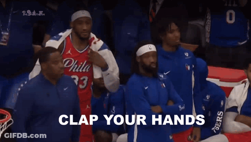 A Group Of Basketball Players Are Sitting In The Stands With The Words " For Philadelphia " Written In White GIF