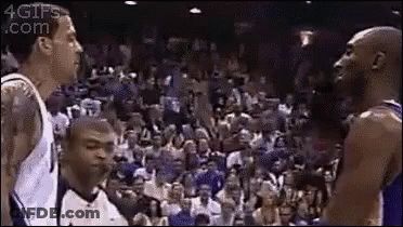 A Group Of Basketball Players Are Standing Next To Each Other On A Court . GIF