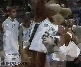 A Group Of Basketball Players Are Standing Next To Each Other On The Court . GIF