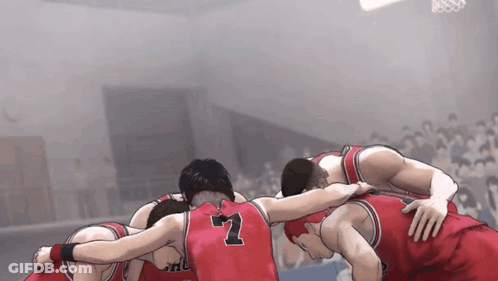 A Group Of Basketball Players Huddled Together With The Number 7 On The Back Of Their Jersey GIF