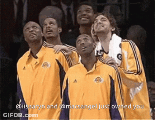 A Group Of Basketball Players Looking Up With The Caption @Iisaaryn And @Macsangel Just Owned You GIF