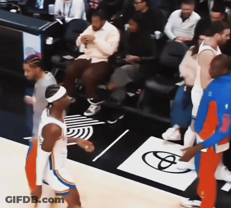 A Group Of Basketball Players Standing On A Court With A Toyota Logo On The Floor GIF