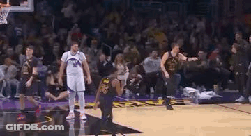 A Group Of Basketball Players Standing On Top Of A Basketball Court . GIF