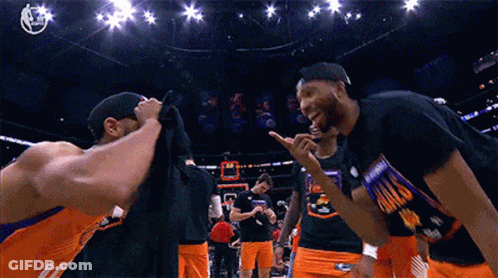 A Group Of Basketball Players Wearing Shirts That Say Phoenix GIF